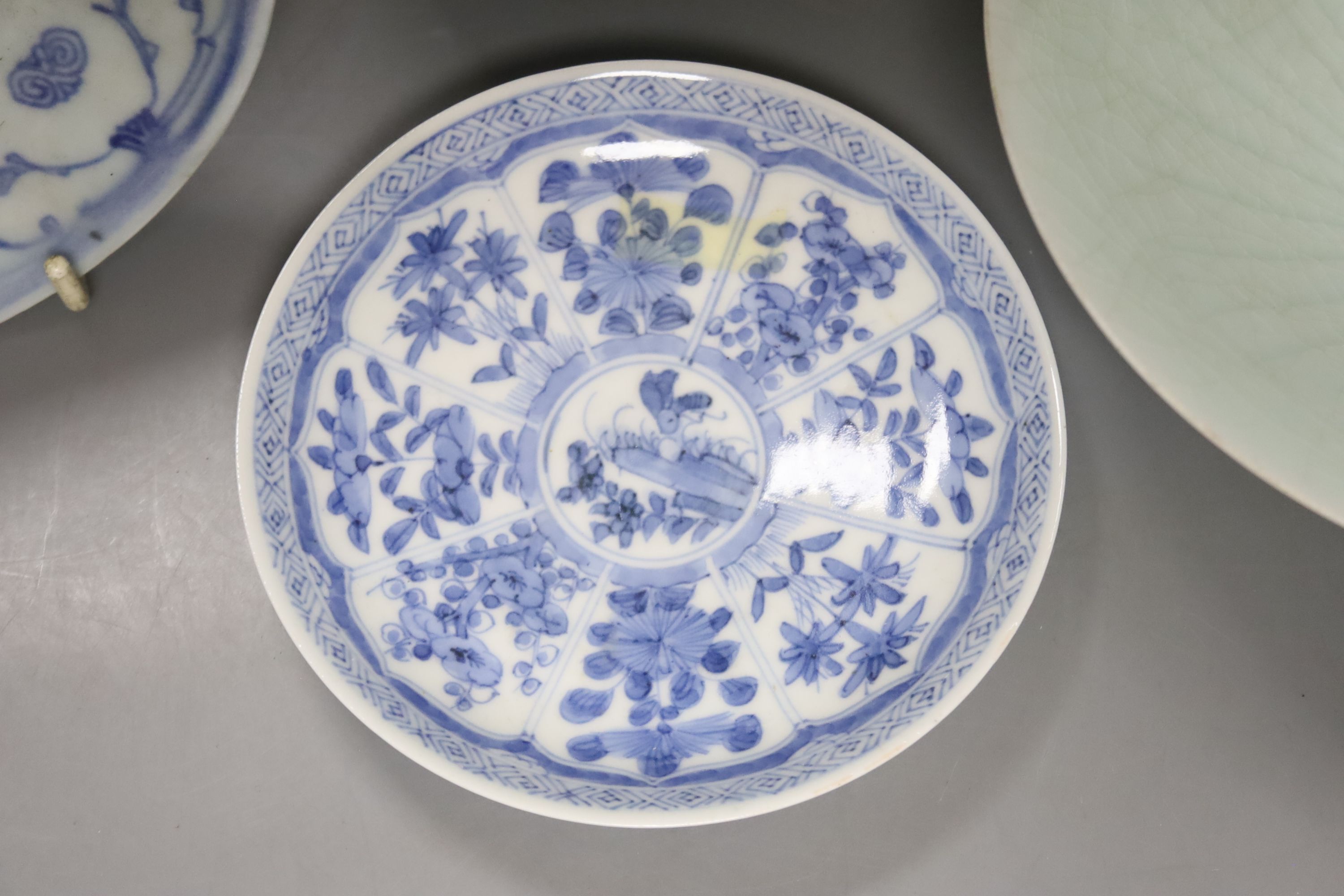 A Chinese celadon glazed vase, height 28cm, together with a crackle glaze bowl, a blue and white teabowl and saucer and a blue and white dish